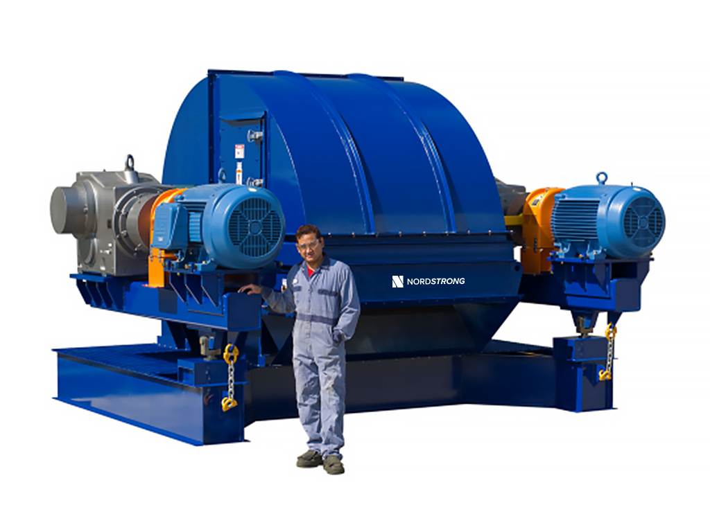 Man standing beside a large blue industrial bucket elevator head section.